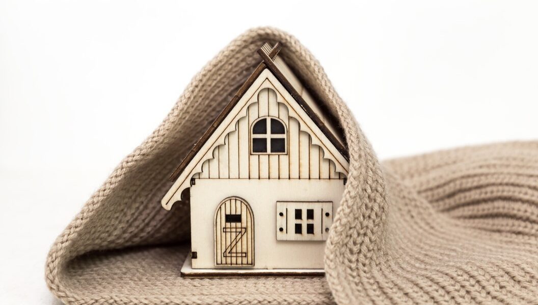 toy-wooden-house-wrapped-in-a-warm-knitted-scarf-on-a-white-background-business-concept-buy_t20_pxAoBj-2